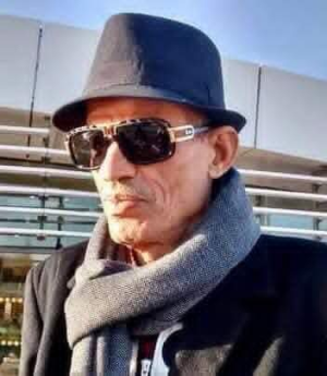 البشير عبيد  -    حين يصير الوطن قصيدة: محمد الصغير أولاد أحمد وبلاغة التمرّد الهادئ